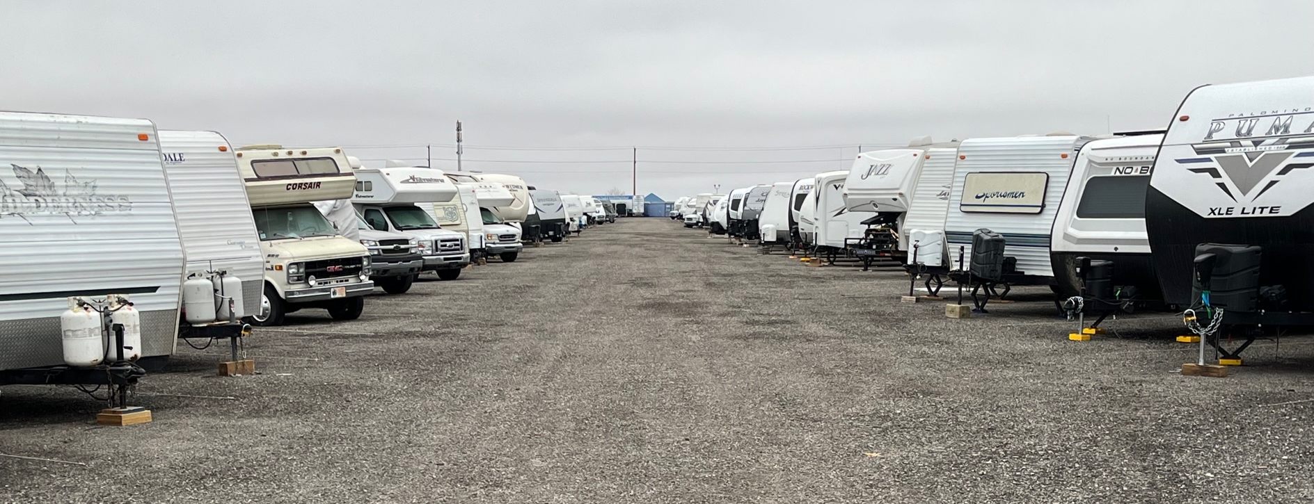 RVs and other vehicles parked in a storage lot
